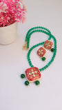 Red Kundan Pendant Set With Green Glass Beads