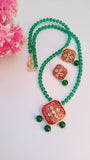 Red Kundan Pendant Set With Green Glass Beads