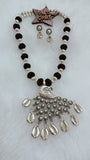 Black Cotton Set In Peacock Silver Pendant