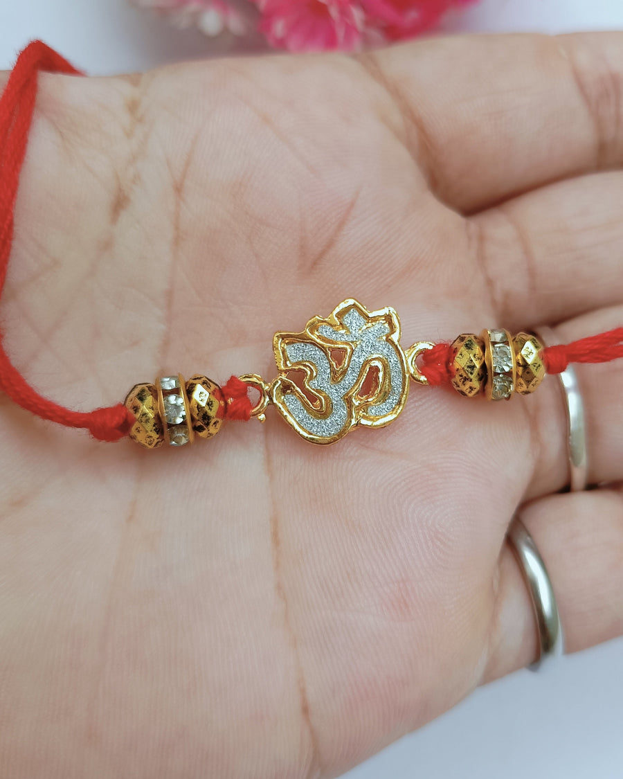 Golden Om Rakhi (Set Of 2)