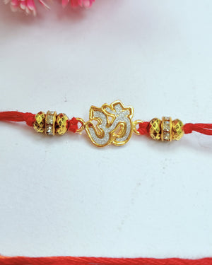 Golden Om Rakhi (Set Of 2)
