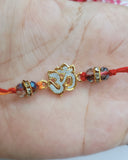 Golden Om Rakhi With Crystal (2 piece)